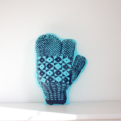 Turquoise trigger mitten pillow.
